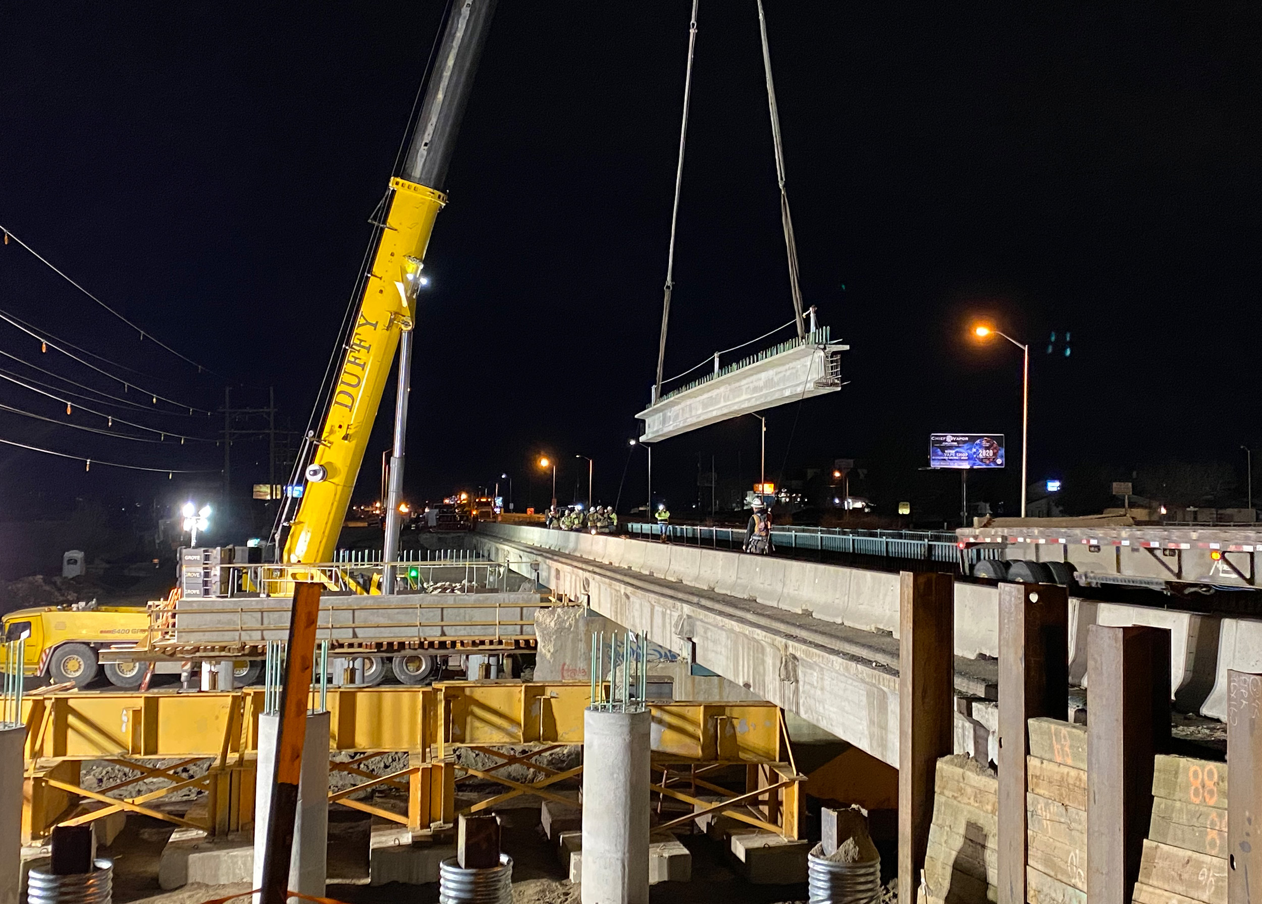 Setting girders of the new Platte Ave Bridge.