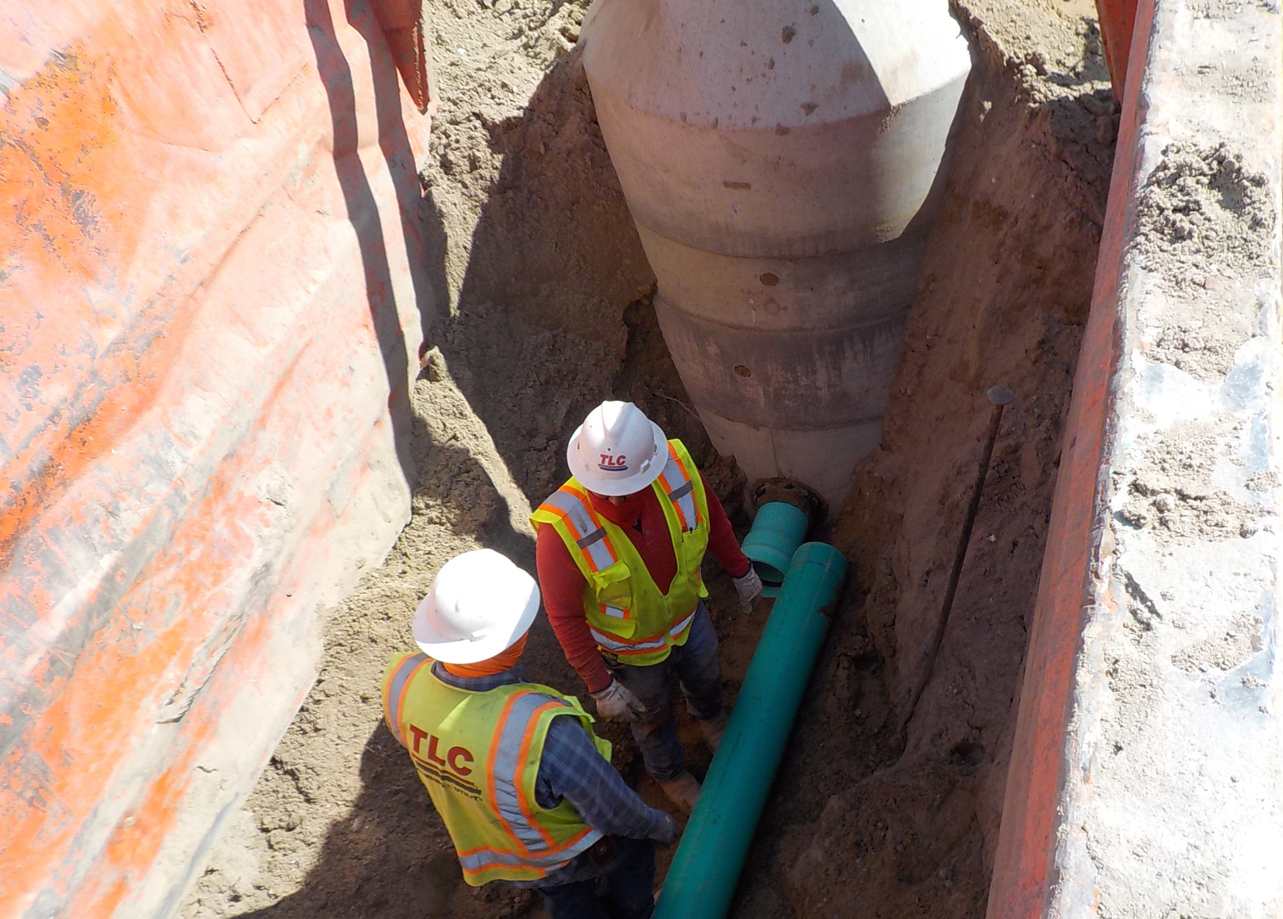 Water service lines were routed down to the RV pad sites with T connections at each pad location, allowing multiple pad sites to be serviced from a single tap off the mainline.