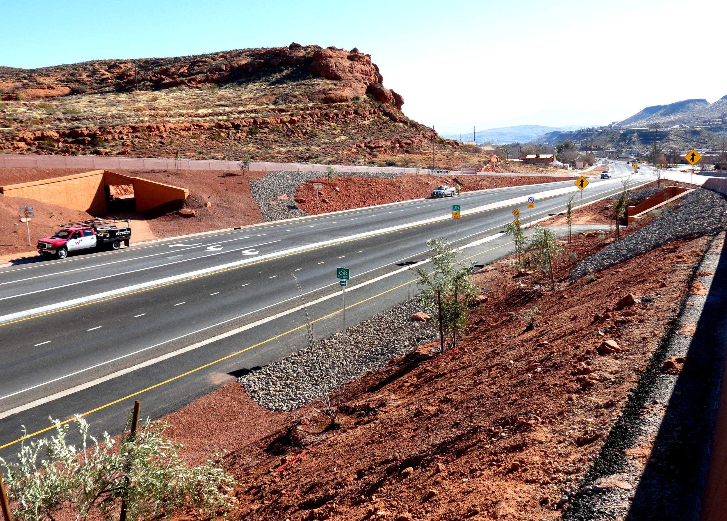 The project reconstructed the intersection with a bicycle/pedestrian trail system that includes five grade separations, allowing pedestrians and bicyclists to get through the interchange without having to cross traffic on Bluff Street.