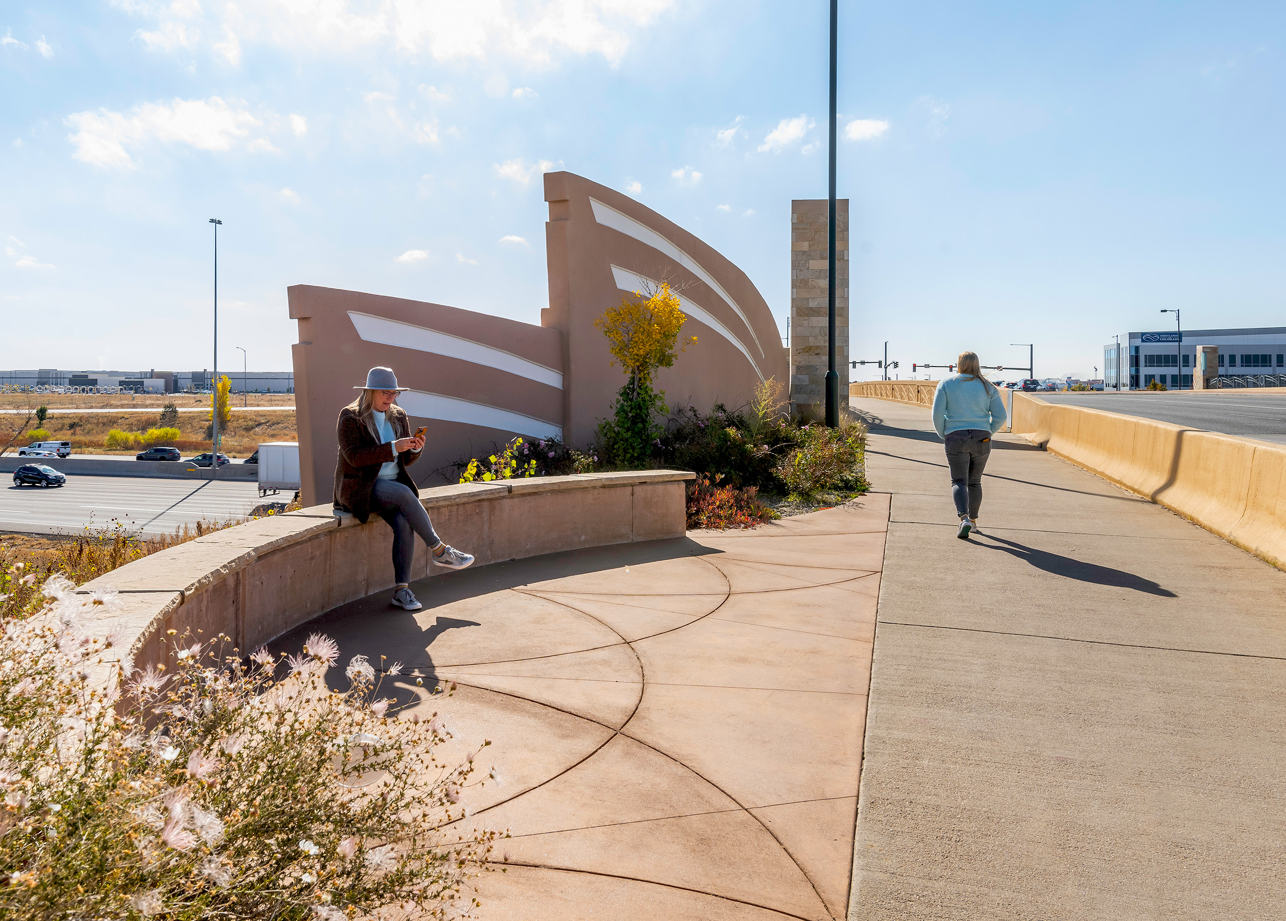This project included Environmental Assessments; lighting; signing, including 11 overhead sign structures; striping; signals; MOT; two water quality ponds; retaining walls; aesthetic enhancements; landscaping; and a mill and overlay of I-70 from the Sand Creek Bridge to Havana Street.
