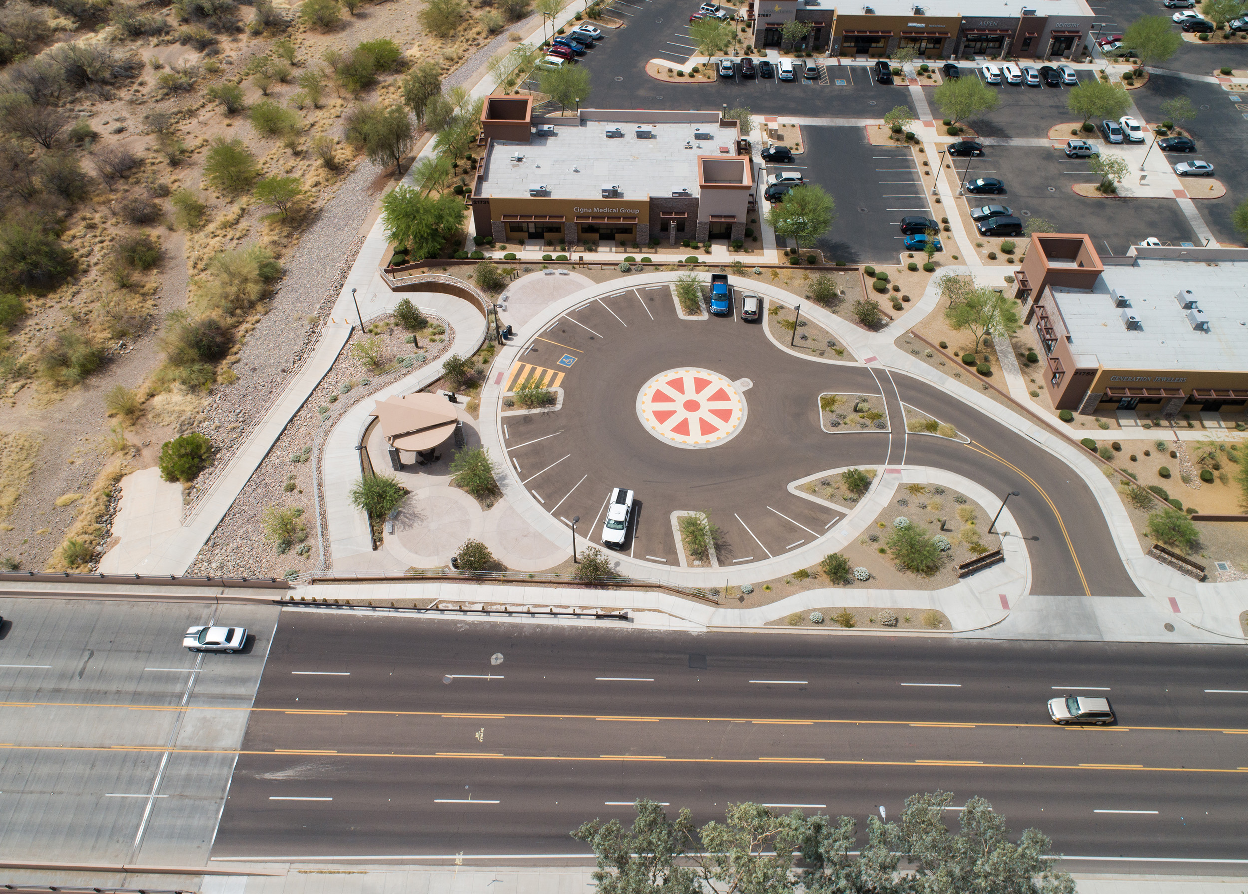 Wilson & Company designed the spoked wheel-inspired parking lot at the New River Trailhead.