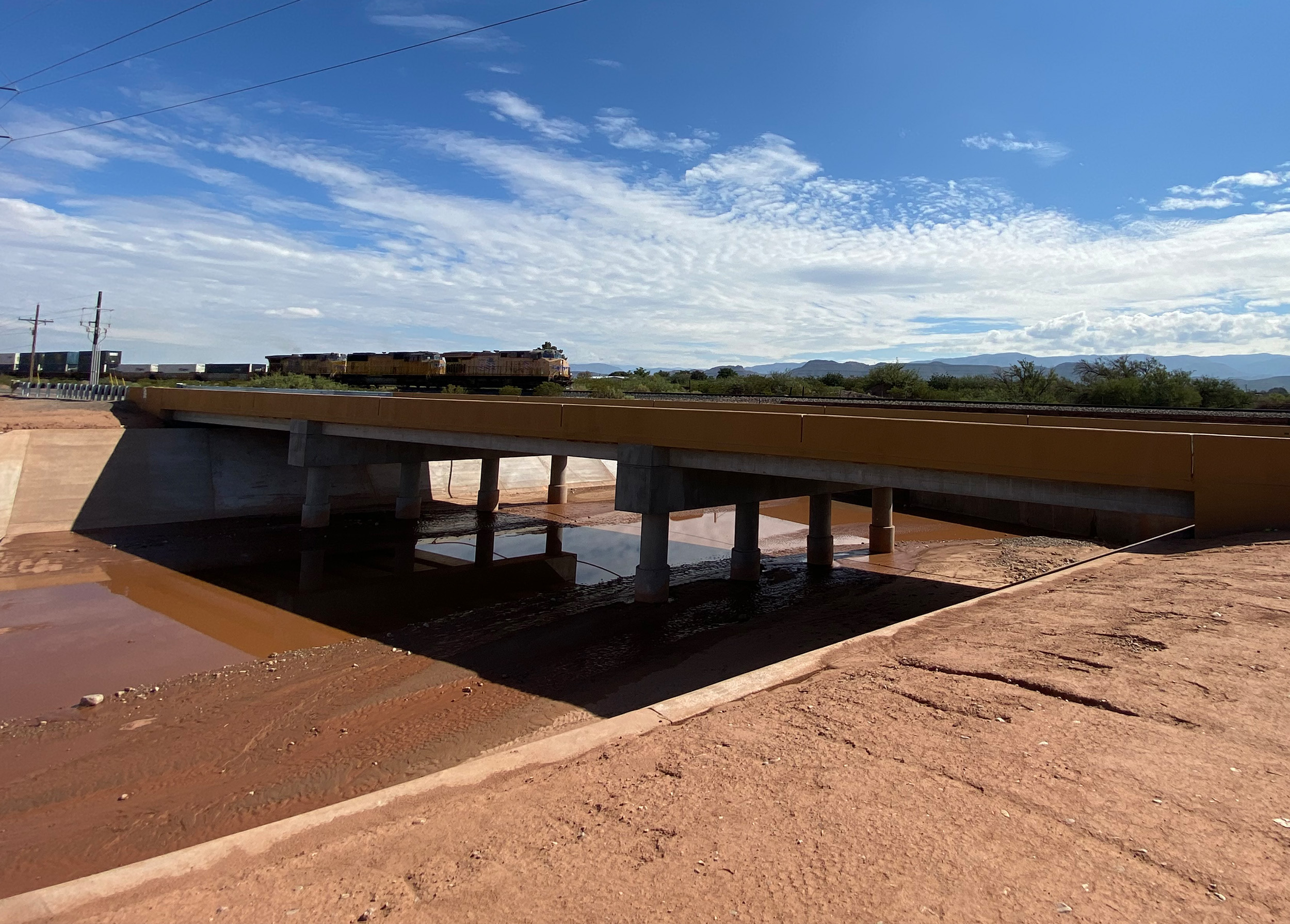 Grade control drop structures, scour protection, and grading and erosion control were designed within La Luz Creek to accommodate the bridge structure.