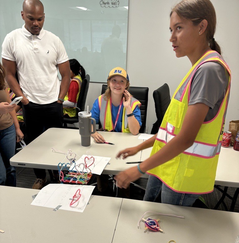 TCG members compete in a bridge building contest hosted at Wilson & Company.