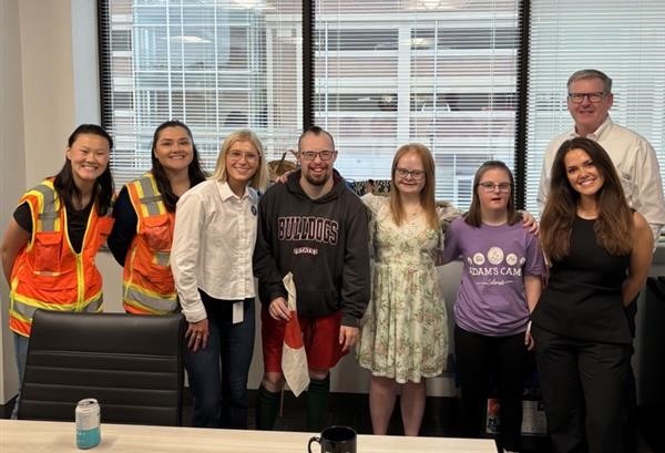 Adam's Camp participants meet with Denver employees.
