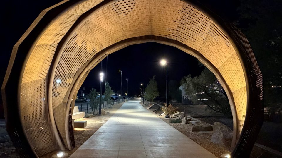 The Northern Gateway Arch incorporates saw accents in the arch design that pay tribute to the area's historic sawmill heritage. The trail is enhanced with a combination of security and accent lighting to encourage safe and inviting pedestrian use both day and night.