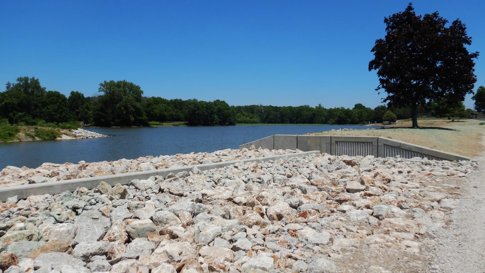 Wilson & Company designed weir spillways and side channel auxiliary spillways to mitigate risk of breach.