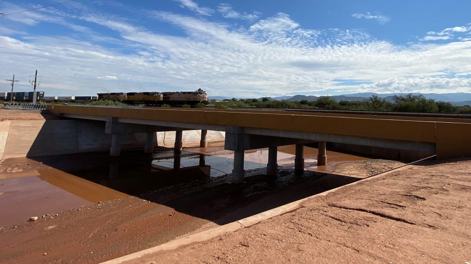 Grade control drop structures, scour protection, and grading and erosion control were designed within La Luz Creek to accommodate the bridge structure.